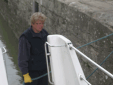 Pat on the stern manning the line in a lock